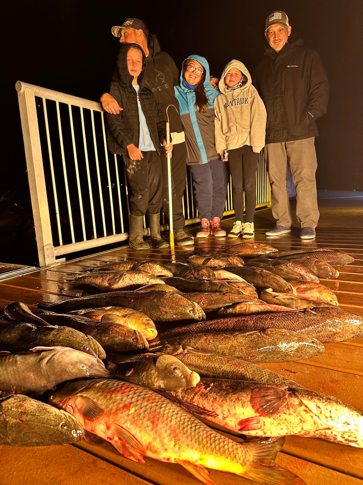 Bowfishing catch on the boat deck at night